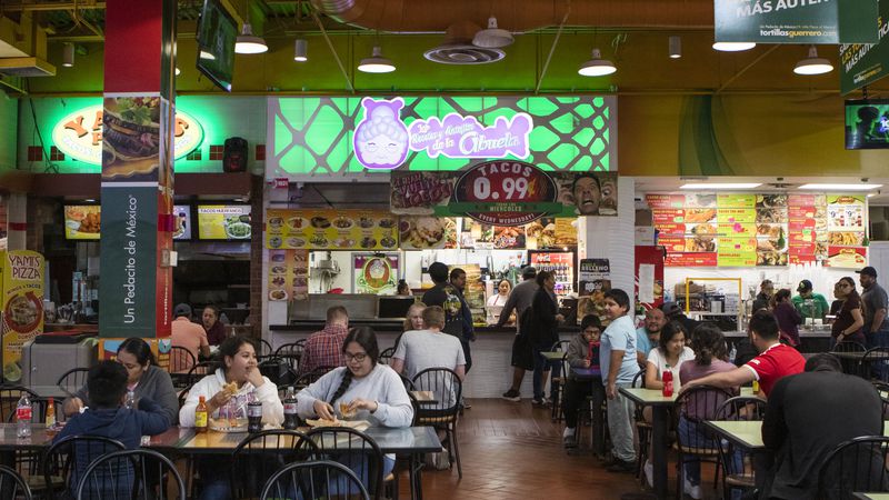 Diners enjoy lunch at Las Recetas y Antojitos de la Abuela, which translates to "Recipes and Treats from Grandma," in the Plaza Fiesta food court.
CHRISTINA MATACOTTA FOR THE ATLANTA JOURNAL-CONSTITUTION.