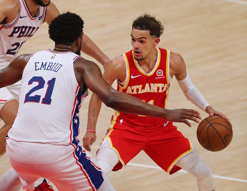 Hawks guard Trae Young finds his drive blocked by Philadelphia 76ers center Joel Embiid in game 3 of their NBA Eastern Conference semifinals series on Friday, Jun 11, 2021, in Atlanta.   “Curtis Compton / Curtis.Compton@ajc.com”