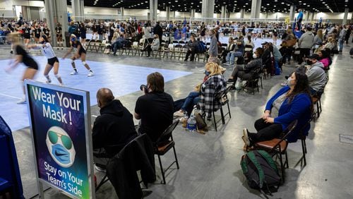 The Lil’ Big South girls volleyball tournament was held at the Georgia World Congress Center last month with spaced seating for spectators and signs reminding people to wear masks. (Ben Gray for The Atlanta Journal-Constitution)