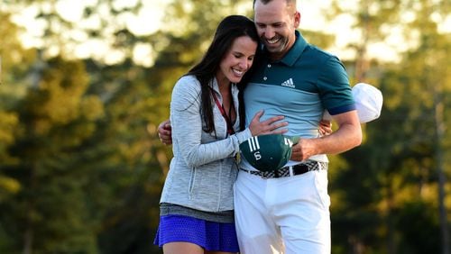 Sergio Garcia and then-fiancee Angela Akins share a moment after his breakthrough 2017 Masters victory. (Harry How/Getty Images)
