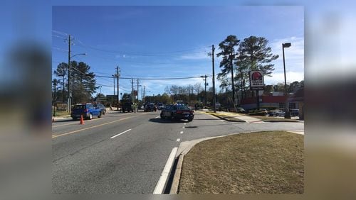 A deadly motorcycle crash shut down part of Roswell Road Saturday afternoon in Sandy Springs, police said.