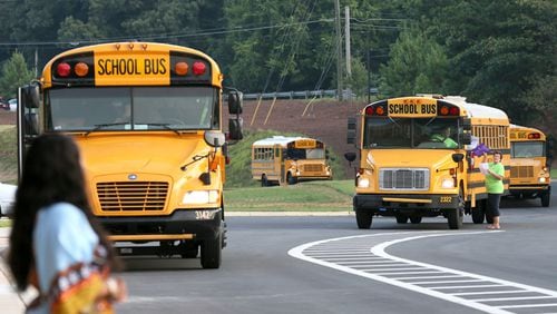 Cherokee County School District officials are encouraging parents in the River Ridge attendance area to have their children ride buses to school because of road construction in the vicinity. AJC FILE