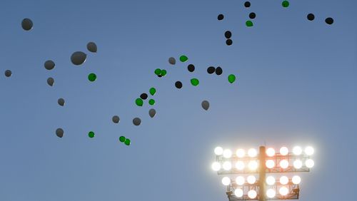 Balloons are released before the start of  a high school football game pitting Roswell against Milton, Friday, Sept. 20, 2019, in Roswell.