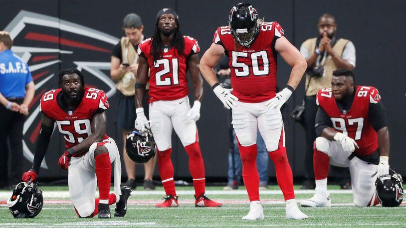 Falcons linebacker De'Vondre Campbell (59), defensive back Desmond Trufant (21), defensive end Brooks Reed (50) and defensive tackle Grady Jarrett (97) react after the Saints scored an apparent touchdown to win in OT on Sept. 23.   It was ruled short of the goal line but the Saints went on to score on the next play.    BOB ANDRES  /BANDRES@AJC.COM