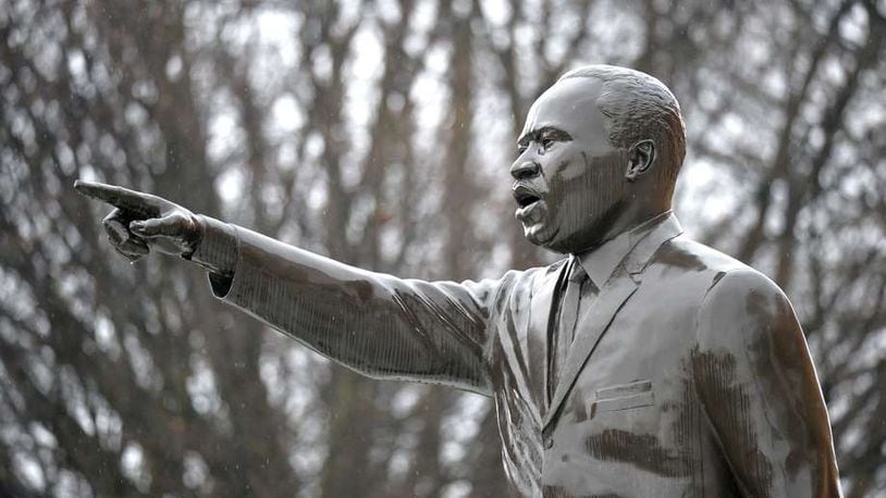 A statue of Martin Luther King Jr. can be seen in front of King’s Chapel on Morehouse College campus. HYOSUB SHIN / HSHIN@AJC.COM