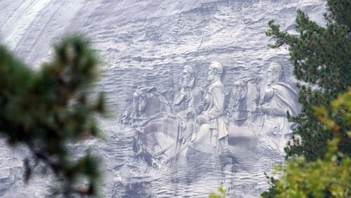 Despite its past and Confederate legacy, Stone Mountain remains a popular site for African-American family reunions and where members of the community go to relax and exercise. The mountain, which is adorned with a huge carving depicting Confederate heroes, is classified as a Confederate memorial by state statute. KENT D. JOHNSON/KDJOHNSON@AJC.COM
