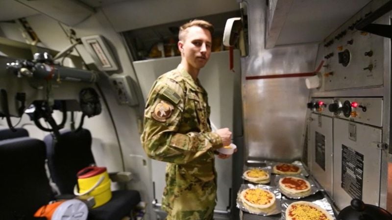 Senior Airman Jordan Smith cooks pizza during refueling missions.