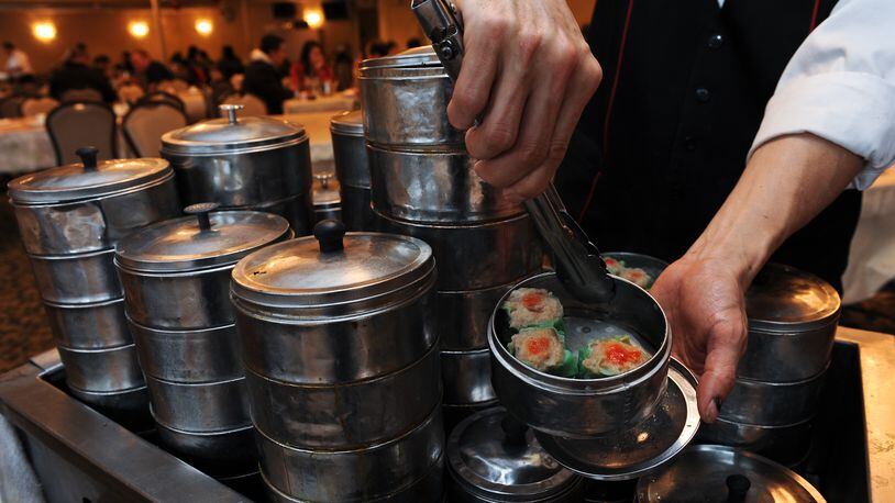 A server offers tableside dim sum service at Canton House.