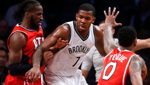 Brooklyn Nets' Joe Johnson (7) works against a double team from Atlanta Hawks' DeMarre Carroll, left, and Jeff Teague (0) during the fourth quarter of an NBA basketball game Wednesday, April 8, 2015, in New York. Atlanta defeated Brooklyn 114-111. (AP Photo/Jason DeCrow) Hawks went 4-0 against Joe Johnson and Brooklyn. (AP photo)
