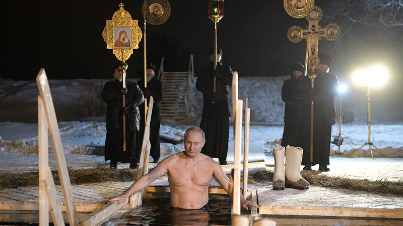 Russian President Vladimir Putin bathes in an ice-cold water on Epiphany neat St. Nilus Stolobensky Monastery on Lake Seliger in Svetlitsa village, Russia, Friday, Jan. 19, 2018. Thousands of Russian Orthodox Church followers will plunge into icy rivers and ponds across the country to mark Epiphany, cleansing themselves with water deemed holy for the day. (Alexei Druzhinin, Sputnik, Kremlin Pool Photo via AP)