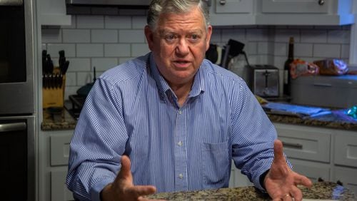 Randy Michael talks about his parent college student loan debt in his Alpharetta kitchen on Oct. 29, 2021. (Steve Schaefer for The Atlanta Journal-Constitution)