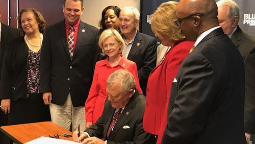 Gov. Nathan Deal signed the fiscal 2018 state budget in Atlanta earlier this year. The budget includes an extra $19 million aimed at keeping more foster parents in the system.