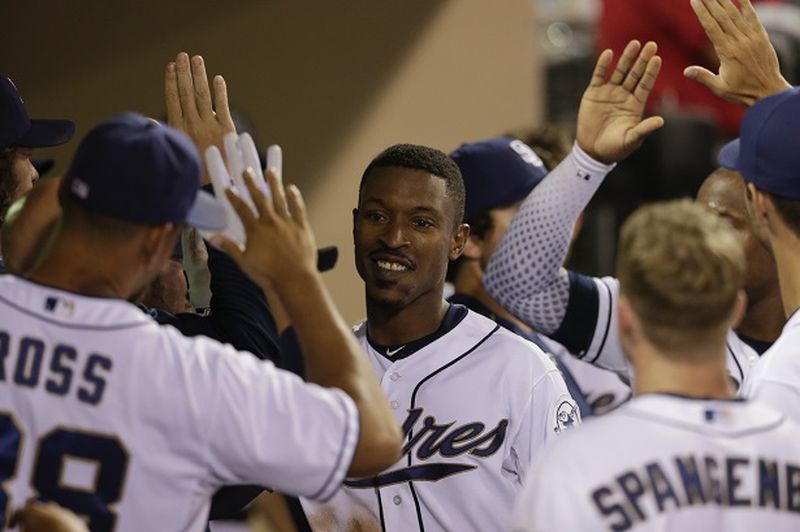 San Diego Padres' Melvin Upton Jr., center, is greeted by teammates after hitting a two-run home run against the Atlanta Braves during the sixth inning of a baseball game Tuesday, Aug. 18, 2015 in San Diego. (AP Photo/Gregory Bull)