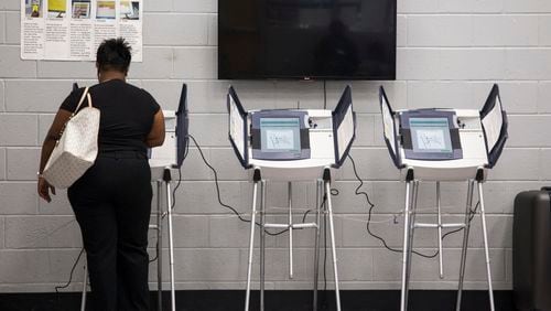 A woman casts her vote during Saturday early voting at the C.T. Martin Natatorium and Recreation Center in Atlanta, Georgia, on Saturday, May 12, 2018. (REANN HUBER/REANN.HUBER@AJC.COM)