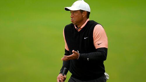 Tiger Woods gestures on the green at the 17th hole during the third round of the PGA Championship golf tournament at Southern Hills Country Club, Saturday, May 21, 2022, in Tulsa, Okla. (AP Photo/Sue Ogrocki)