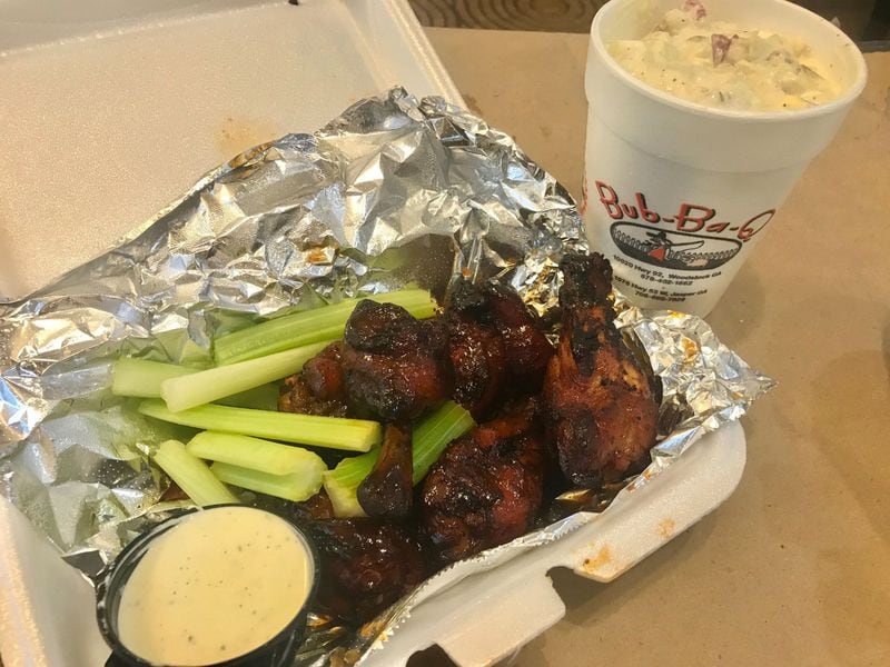 An order of wings comes with the standard celery sticks and Ranch dressing. For a carbo load, order the potato salad. LIGAYA FIGUERAS/ LIGAYA.FIGUERAS@AJC.COM