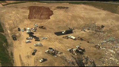 Authorities are investigating after a body was found in a North Georgia landfill.