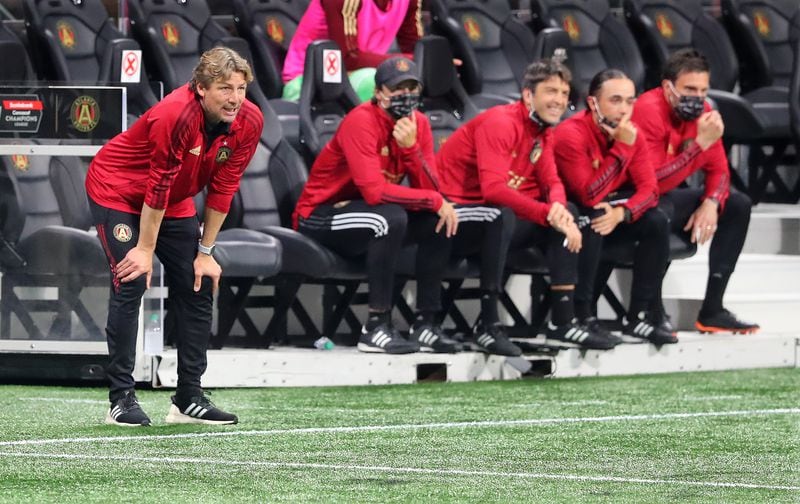 Atlanta United head coach Gabriel Heinze (far left) and his coaching staff follow the game action against the Philadelphia Union in the first leg of the CONCACAF Champions League quarterfinal match Tuesday, April 27, 2021, at Mercedes-Benz Stadium in Atlanta. Atlanta United fell 3-0. (Curtis Compton / Curtis.Compton@ajc.com)