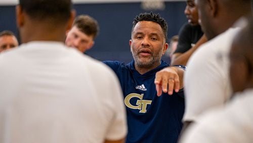Georgia Tech men's basketball coach Damon Stoudamire works with his team during a practice.