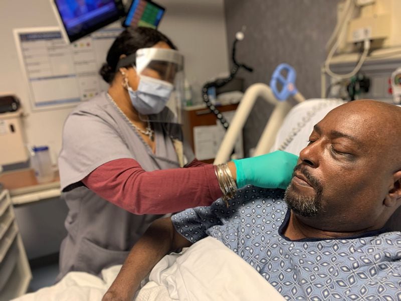 Tyrone Milner, an inpatient at the Spinal Care Injury Unit of the Charlie Norwood VA Medical Center, receives a COVID-19 vaccine Tuesday, Dec. 15, 2020. Milner was the first patient at the medical center to receive the vaccine. (Photo courtesy of Charlie Norwood VA Medical Center) 