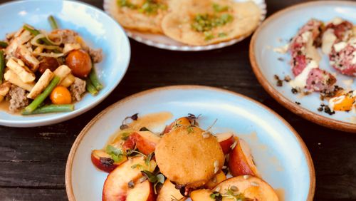 A peach salad with fried brie is a summer stunner at Banshee. In the background: Parisian gnocchi, fry bread and tomato Caesar. CONTRIBUTED BY WENDELL BROCK