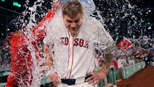 Boston Red Sox pitcher Tanner Houck is doused after throwing a three-hitter against the Cleveland Guardians in baseball game Wednesday, April 17, 2024, in Boston. The Red Sox won 2-0. (AP Photo/Charles Krupa)