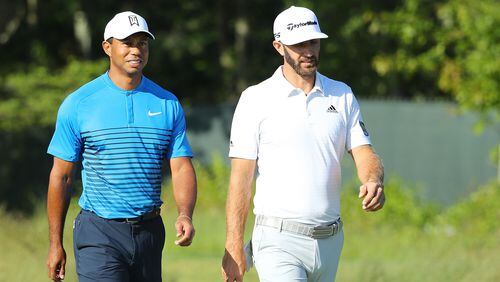 A new power couple sighted at the U.S. Open: Tiger Woods and Dustin Johnson walk it off during a Tuesday practice round at Shinnecock Hills. (Warren Little/Getty Images)