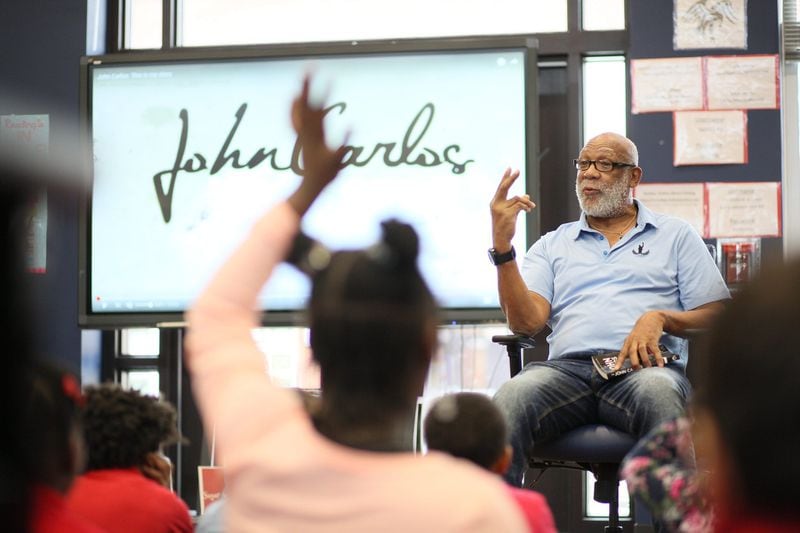 John Carlos answers students’ questions at Barack H. Obama Elementary Magnet School of Technology on Wednesday, Feb. 26, 2020 in Atlanta. (Photo: MIGUEL MARTINEZ for the AJC)