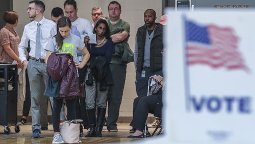 Voters waited over an hour to vote at Henry W. Grady High School on Tuesday Nov. 6, 2018. Metro Atlanta polling places reported steady lines as voters went to the polls Tuesday. JOHN SPINK/JSPINK@AJC.COM