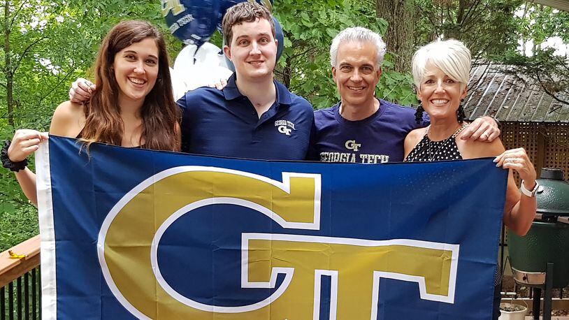 Clark Jacobs, second from left, celebrated his accomplishment with his family, including sister, Kelsey, and parents Ron and Mariellen, at the family's Cobb County home.