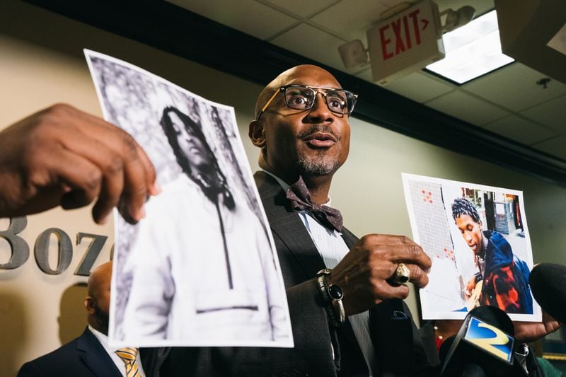 Mawuli Davis, attorney for the family of Shawndre Delmore, presents photos of the deceased during a press conference at the Davis Bozeman Law Firm in Decatur, Georgia on Thursday, Sept. 7, 2023. Delmore died after spending about five months inside the Fulton County Jail. He was the 10th death this year in the custody of the Fulton County Sheriff's Office. (Olivia Bowdoin for the AJC). 