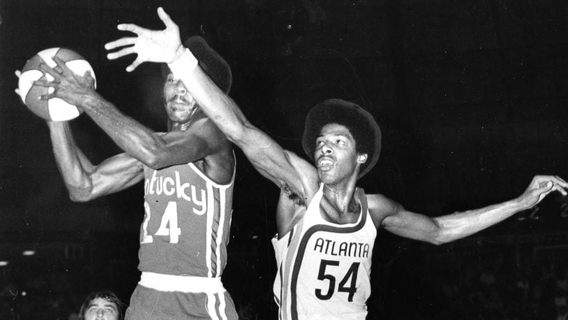 Julius Erving (54) plays for the Atlanta Hawks in an exhibition game on September 1972 against the Kentucky Colonels. Erving signed a contract with the Hawks, giving them a formidable roster that included Pete Maravich, Walt Bellamy and Lou Hudson, but a judge ruled his contract belonged to an ABA team. Erving returned to the Virginia Squires. This rare photo was shot by Chuck Vollertsen of the Atlanta Journal.