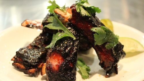 The incredibly tender lamb ribs at Under the Cork Tree are crusted with a charred, spicy-sweet glaze. (Lake Sheetz)