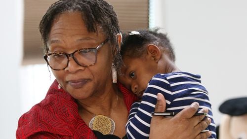 4/19/19 - Sandy Springs - Wanda Irving holds Soleil Irving, 2, in their home in Sandy Springs, Georgia on Friday, April 19, 2019. Wanda Irving is raising her granddaughter, Soleil.  Her daughter, Dr. Shalon Irving, died in 2017 shortly after giving birth. Wanda Irving's daughter, Shalon, 36, died of cardiac arrest from complications related to hypertension three weeks after giving birth.  EMILY HANEY / emily.haney@ajc.com