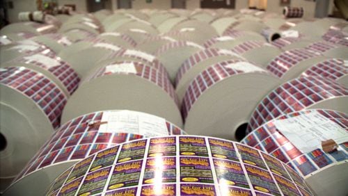 970514 - Forsyth County, Georgia - Large rolls of pre-printed lottery tickets sit on the floor of the Scientific Games facility in Forsyth County Georgia on May 14, 1997. The plant takes care of the design, printing and packing of lottery scratch-off games for Georgia and other states. (AJC Staff Photo/Kimberly Smith)