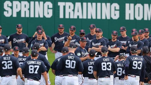 Braves manager Brian Snitker gathers his team for the first full-squad workout of 2017 spring training at Disney’s ESPN Wide World of Sports near Orlando.