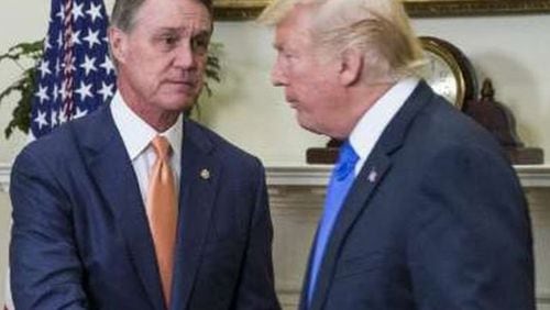 Georgia U.S. Sen. David Perdue, left, meets with President Donald Trump. Trump’s legislative director, Marc Short, recently told a publication that “there’s been no more ardent supporter of the president” than Perdue in the Senate.