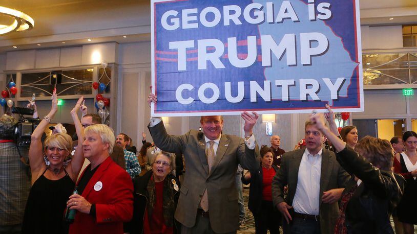 Republican voters celebrate as it is projected Trump wins Georgia at the Republican Watch party at the Grand Hyatt, Buckhead, on Tuesday, Nov. 8, 2016, in Atlanta. (Curtis Compton / ccompton@ajc.com)