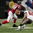 Falcons tight end Tony Gonzalez makes a reception and turns up field for yardage past Buccaneers linebacker Barrett Ruud.
