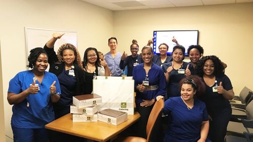 Hospital workers at Emory receive a delivery donated through the Meal Bridge.  COURTESY OF THE MEAL BRIDGE