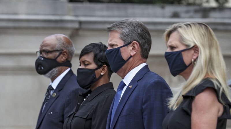 7/29/20 - Atlanta, GA - Georgia First Lady Mary Kemp (from right), Gov. Brian Kemp, Atlanta Mayor Keisha Lance Bottoms, State Rep. Calvin Smyre, stand to receive the body of Rep. John Lewis into the state capitol.  On the fifth day of the “Celebration of Life” for Rep. John Lewis, Lewis’s body and and family members returned to Georgia for ceremonies at the State Capitol where he will also lie in state until his funeral on Thursday.  Alyssa Pointer / alyssa.pointer@ajc.com