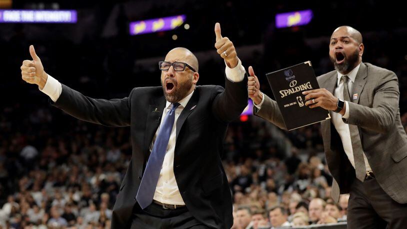Memphis Grizzlies head coach David Fizdale, left, and assistant J.B. Bickerstaff, right, argue a call during the second half in Game 2 of a first-round NBA basketball playoff series against the San Antonio Spurs, Monday, April 17, 2017, in San Antonio. San Antonio won 96-82.(AP Photo/Eric Gay)