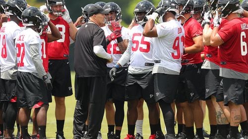 Falcons coach Dan Quinn instructs players during rookie minicamp. Curtis Compton/ccompton@ajc.com