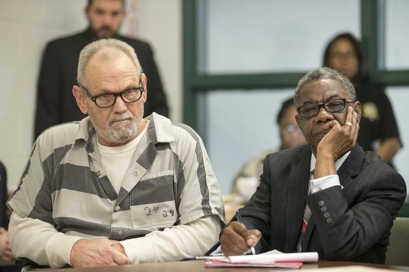 Bill Moore Sr. and his lawyer, Harry Charles, right, listen during a preliminary hearing in a Spalding County courtroom on November 30, 2017. Moore and Frankie Gebhardt are accused of killing Timothy Coggins in 1983. Authorities say the killing was racially motivated. 