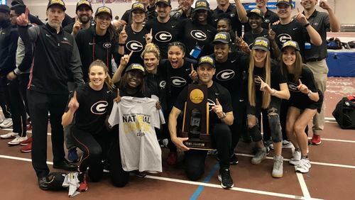 Georgia coach Petros Kyprianou (r, kneeling) is expected to be coaching his last meet for the Bulldogs when they compete in the NCAA Outdoor Track & Field Championships in Eugene, Ore., this week. (Photo from UGA Athletics)