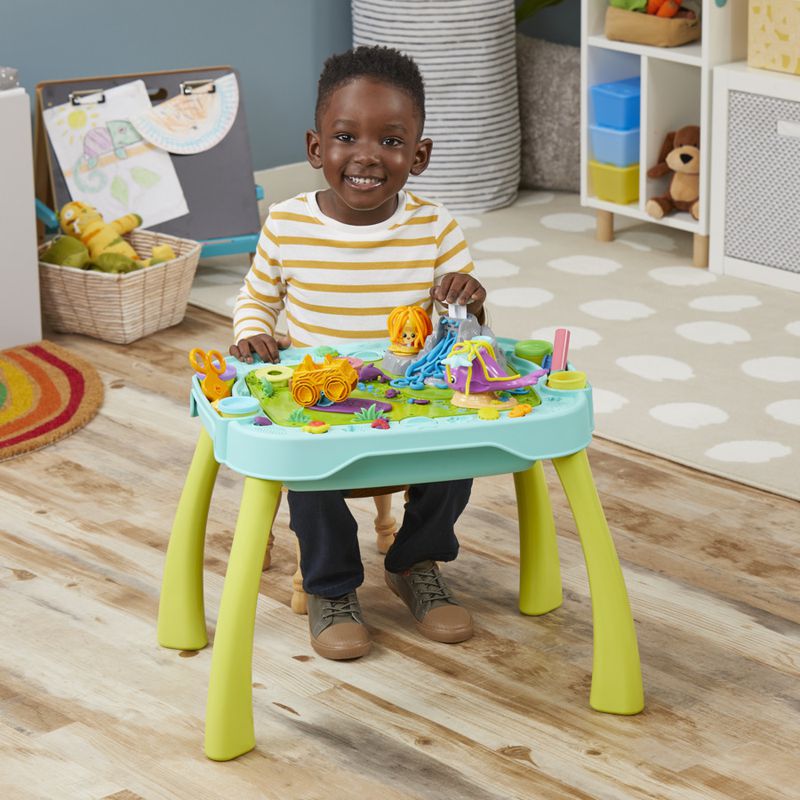 A creative Play-Doh station has a dual-sided tabletop, accessories and vibrant jars of the moldable compound.
(Courtesy of Hasbro)