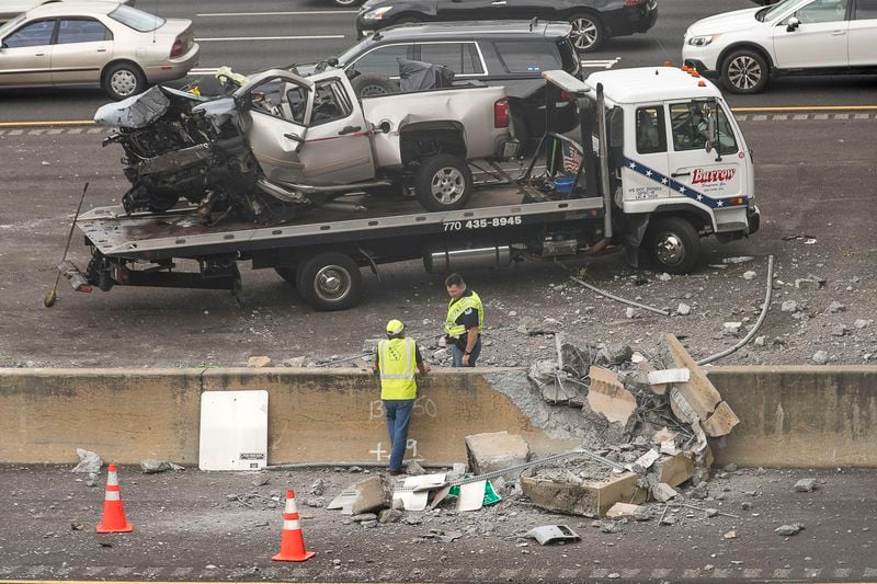Workers clear the scene of the deadly accident.