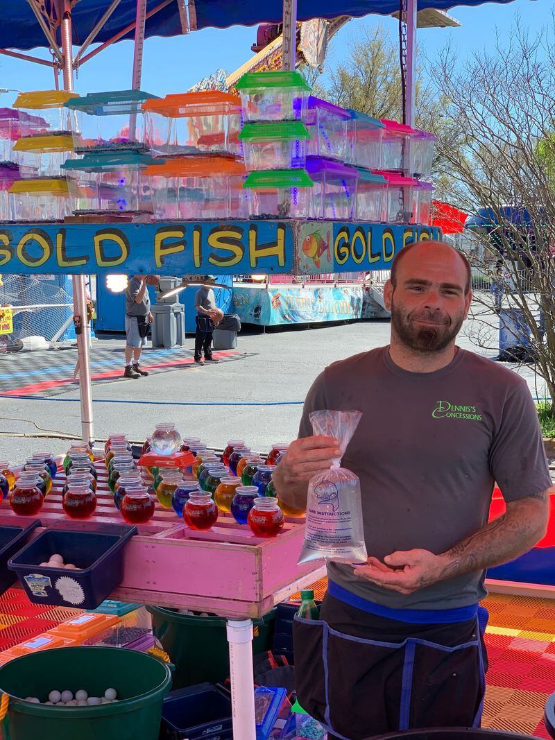 William Adams III runs the goldfish booth and has worked carnivals for several years. Photo by Grady McGill