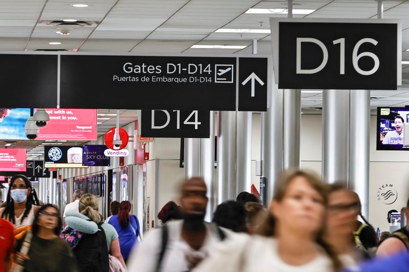 Passengers walk through Concourse D at Hartsfield-Jackson International Airport on Thursday, July 7, 2022.  (Natrice Miller/natrice.miller@ajc.com)
