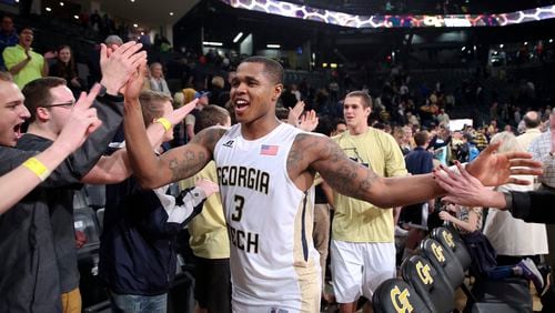 Georgia Tech guard Marcus Georges-Hunt (3) celebrates with fans after derating Clemosn 75-73 in an NCAA college basketball game Tuesday, Feb. 23, 2016, in Atlanta. (AP Photo/John Bazemore)